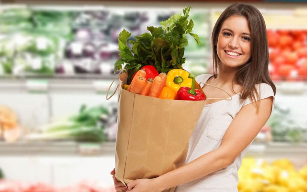 Woman with a bag of fresh vegeta